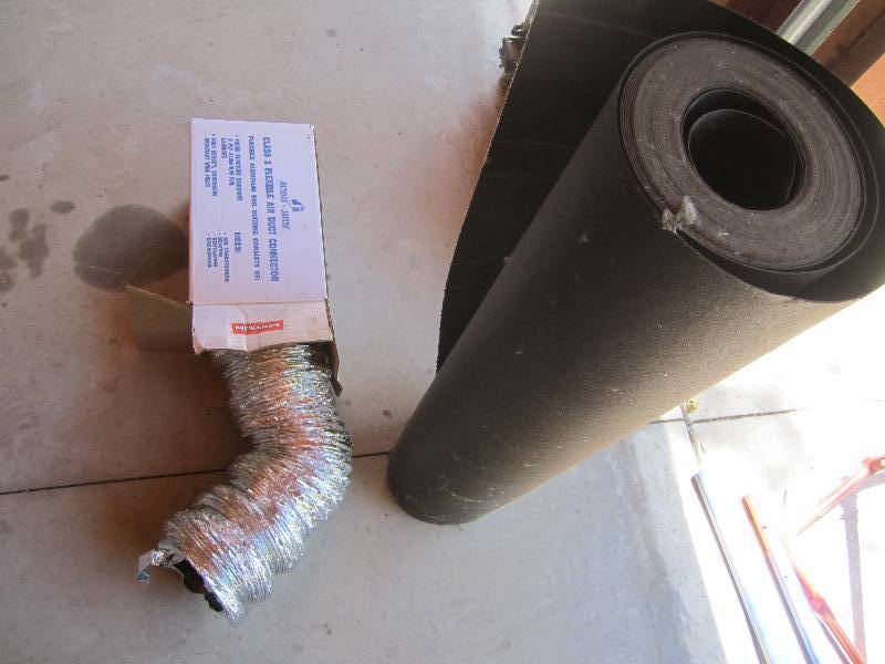 lot 32 image: New air duct and roll of roofing ta...