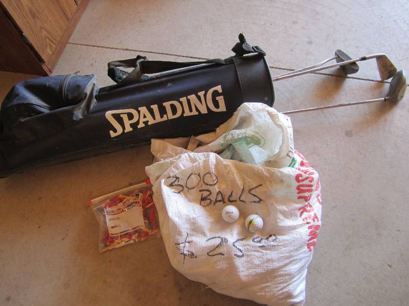 lot 111 image: Golf clubs balls and Ts...