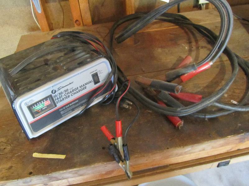 lot 158 image: Battery charger and jumper cables...