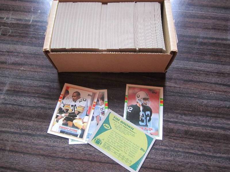 lot 198 image: Box of 89 90 Topps football cards...