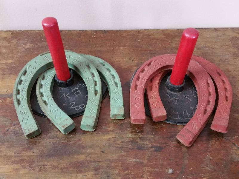 lot 38 image: 1950s Western Rubber & Wood Toy Horseshoes