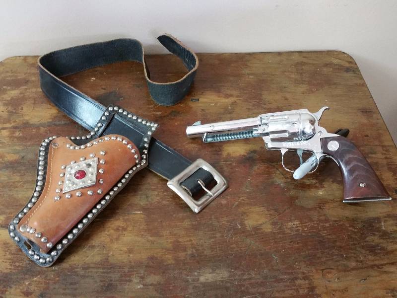 lot 42 image: Handsome Leather & Metal Ruby Holster and Cowhand Cap Gun