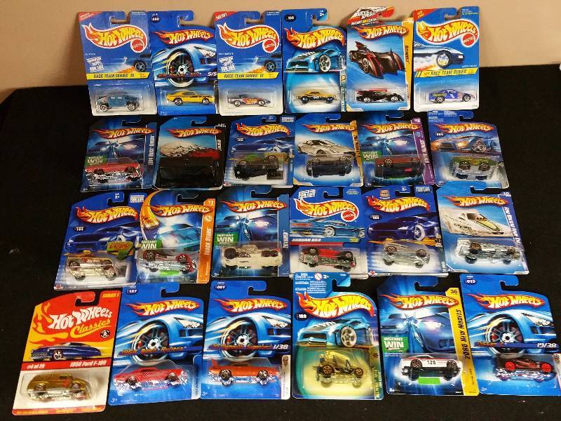 lot 102 image: 24 Unopened 1990s  2000s Hotwheels in the Original Packaging