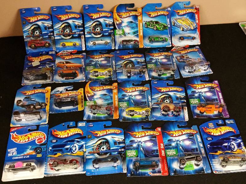 lot 103 image: 24 Unopened 1990s  2000s Hotwheels in the Original Packaging