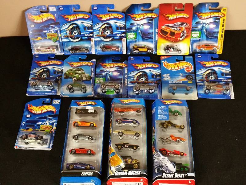 lot 104 image: 28 Unopened 1990s  2000s Hotwheels in the Original Packaging