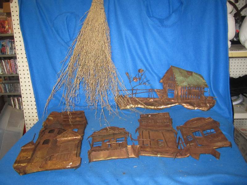 Lot of metal artwork and a wood bro...
