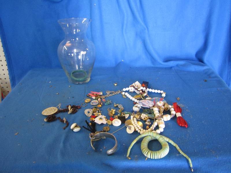 Glass vase containing costume jewle...