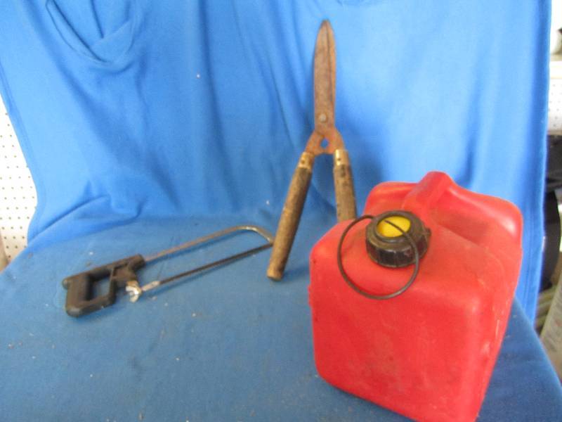 clipper, saw and gas can...