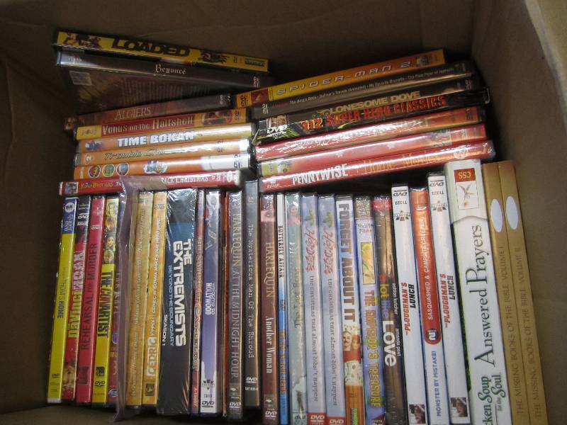 Lot of new shrink wrapped DVDs...