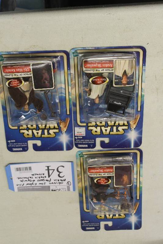 lot 34 image: Lot of (3) Hasbro Star Wars Attack Of The Clones Action Figures Including 1) Anakin Skywalker Outland Peasant Disguise AND 1) Obi-wan Kenobi Jedi Straighter Pilot AND 1) Hasbro Attack Of The Clones Zam Wesell AND 1) Anakin Skywalker Tatooine Attack