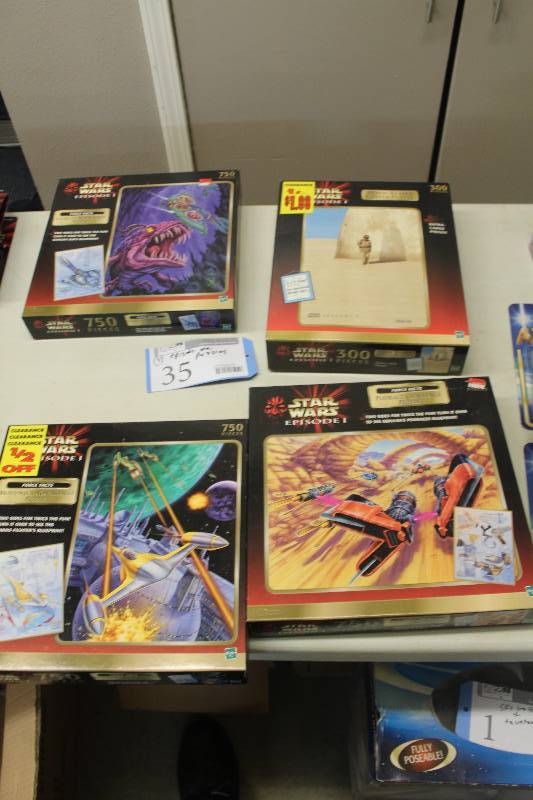 lot 35 image: Lot of (4) Hasbro Star Wars Episode 1 Puzzles Including 1) 300-Piece Movie Teaser AND 1) 750-Piece Podrace Challenge AND 1) 750-Piece Bravo Squadron Assault AND 1) 750-Piece Escape