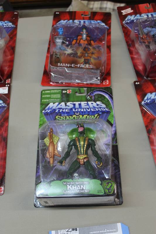 lot 114 image: Lot of (3) Mattel Masters Of The Universe Action Figures Including 2) Man-E-Faces AND 1) Venon Spitting Khan Lanza-Veneno