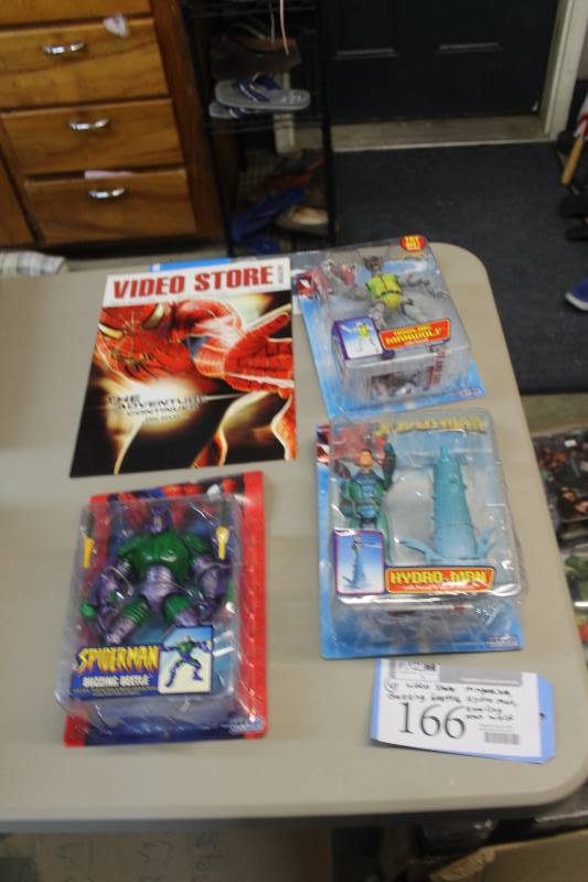 lot 166 image: Lot of (4) Spiderman Collectibles Including 1) Video Store Magazine AND 1) Action Figure Buzzing Beetle AND 1) Action Figure Hydro Man AND 1) Action Figure Howling Man Wolf