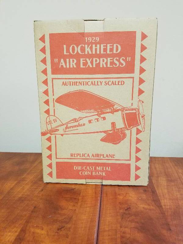 lot 64 image: 1929 Lockheed Air Express Diecast Bank Airplane by ERTL