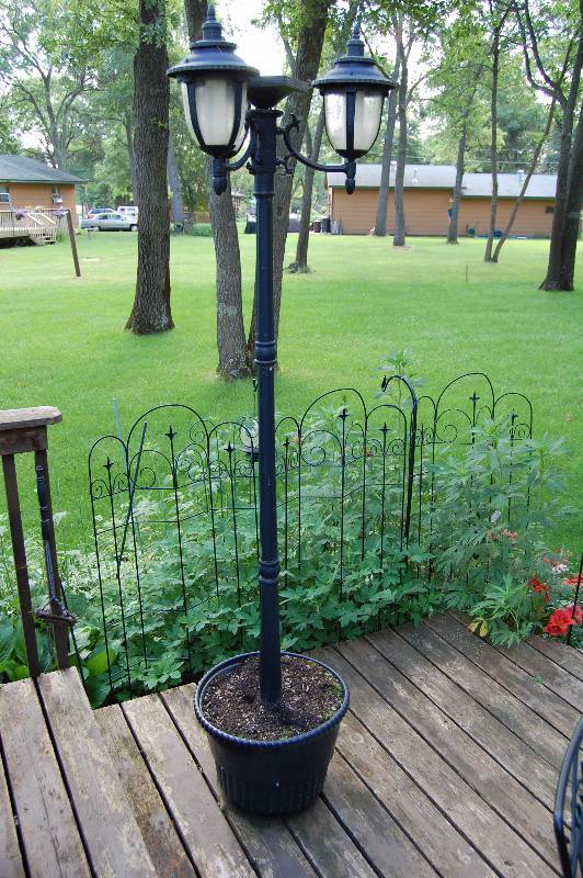 lot 100 image: Outdoor Planter and Lamppost