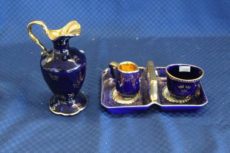 lot 442 image: Lot of (4) Rare Cobalt Blue w Gold Gilv Porcelain Including 1) French 1950s Limoges Castel Porcelain Pitcher AND 1) English Serving Tray AND 1) Fraunfelter 289.5 Cup AND 1) Swedish Rorlfraund Cup