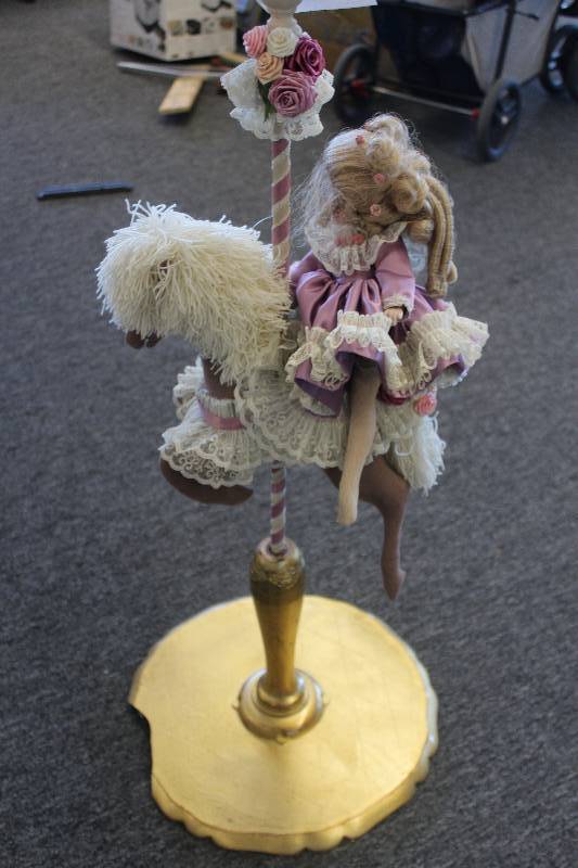 lot 523 image: Doll On Horse Figurine
