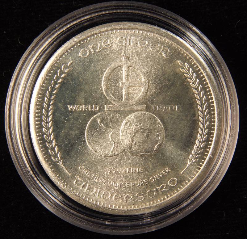 1 TROY OZ. .999 FINE SILVER ROUND IN AIRTITE 1974 UNIVERSARO WORLD TRADE