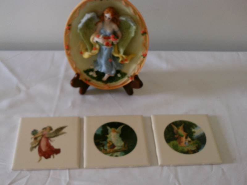 lot 6 image: 3D angel plaque and three angle tiles