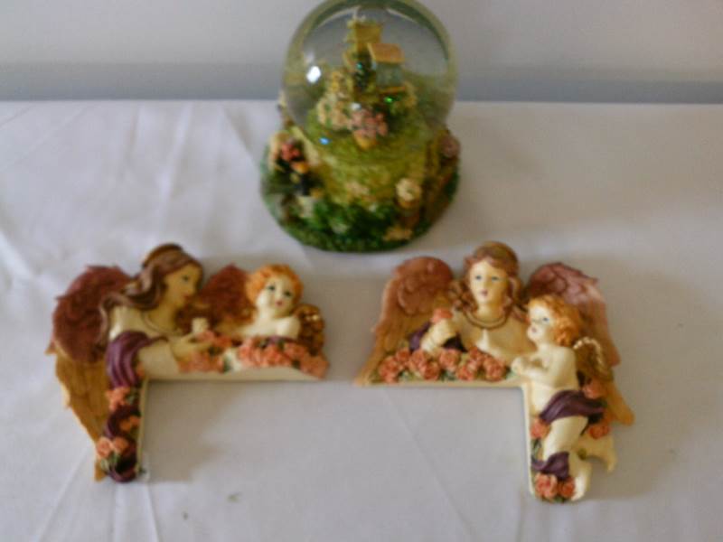 lot 15 image: Angel door frame accents  and snow globes