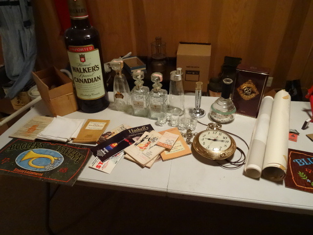 Bar items. Decanters, Books, Rags, Wall Clock,