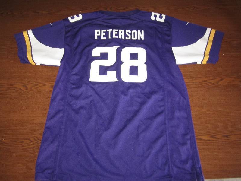 lot 70 image: New Youth XL Vikings Jersey...
