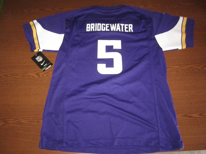 lot 71 image: New Youth XL Vikings Jersey...