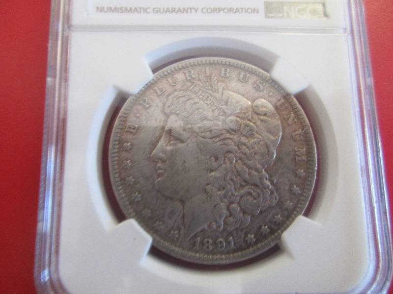 Lot #1 - 1891 CC (Carson City Mint) NGC Certified XF45 VAM-3 Spitting Eagle. This Van Allen Marking (VAM) has the oval indentation extending out from the reverse eagles beak giving it the look of a spitting eagle. High collectability.