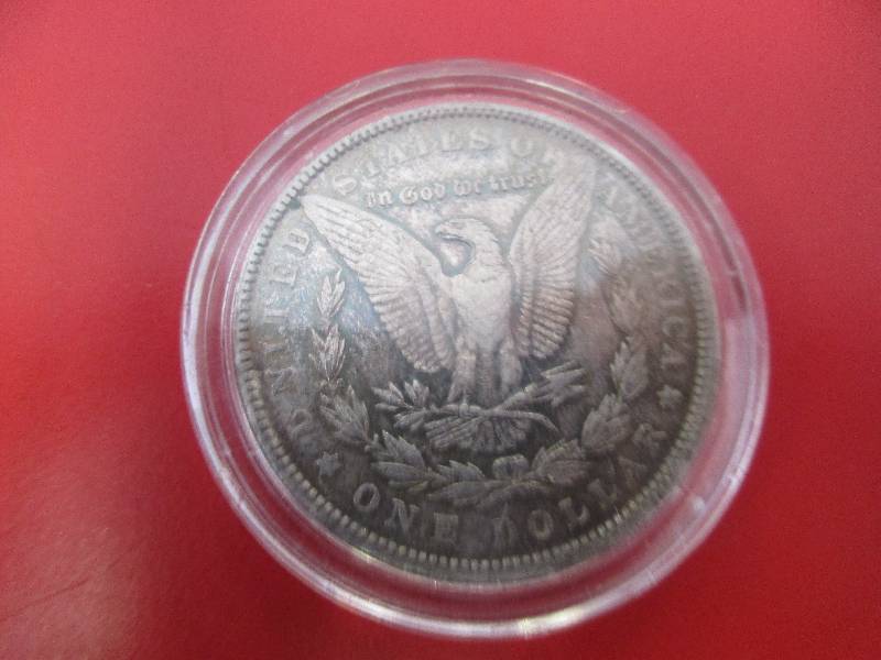 Lot #17 - 1898-P Morgan Silver Dollar with beautiful blue toning on the obverse facia.  Believed to be in AU condition.