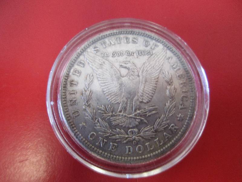 Lot#19 - 1884-O Morgan Silver Dollar in AUBU Condition with smokygolden toning and cartwheel effect. Very nice toning on a high quality MSD.