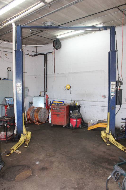 lot 4 image: Hallmark Industries Lift Metric 9K Pound Two Post Lift