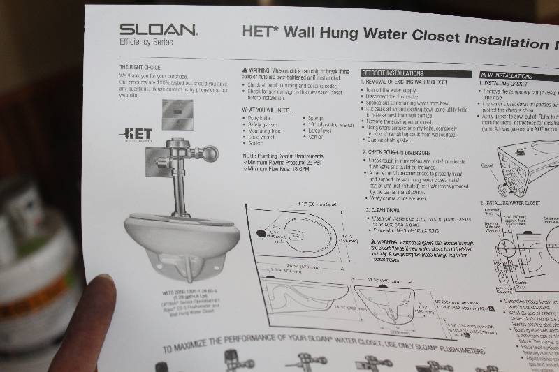lot 169 image: Sloan HET Wall Hung Toilet, New in Box