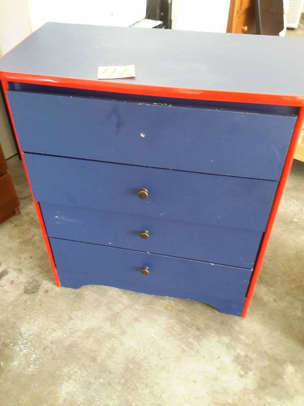 Wood dresser.. Laminate covered top and sides.. Missing one knob.  33in x 17 in x 38 in h.. Solid good shape