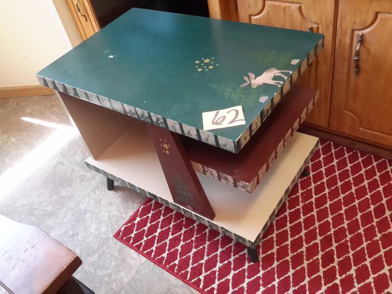 Solid wood end table with winter theme dcor.. Obviously, Hand painted.  Very nice shape.  18in x 28 in x 22in h.