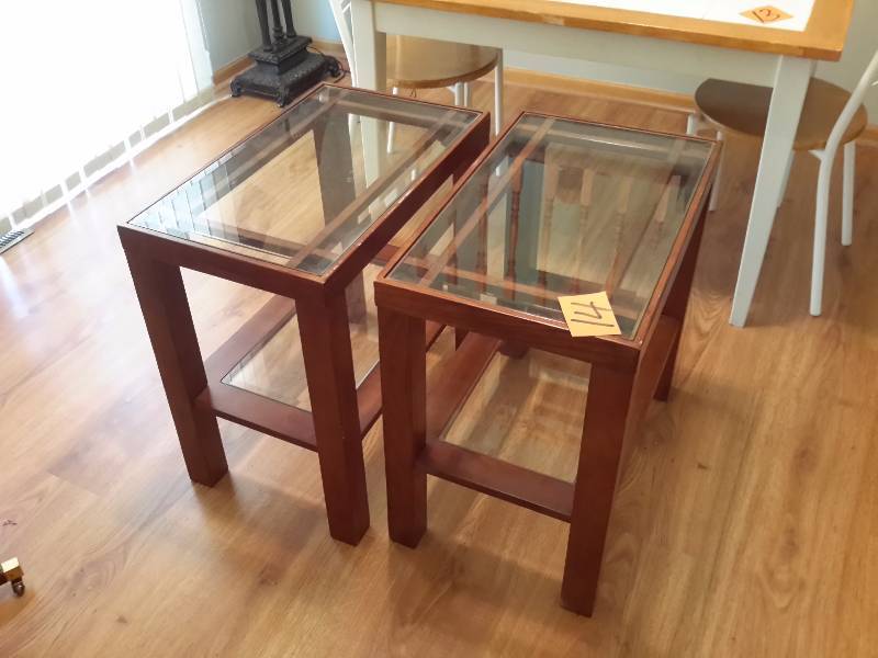 2 nice wood framed with beveled glass top end tables.  Glass shelf.   Each 16in x 26in x 25in h.