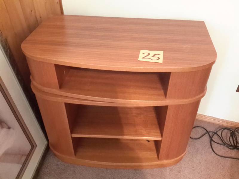 Nice Wood Veneer TV stand.. Swivels and has storage as shown.  Dim 31 12 in w x 18 in d x 27 12 in h.  Nice shape