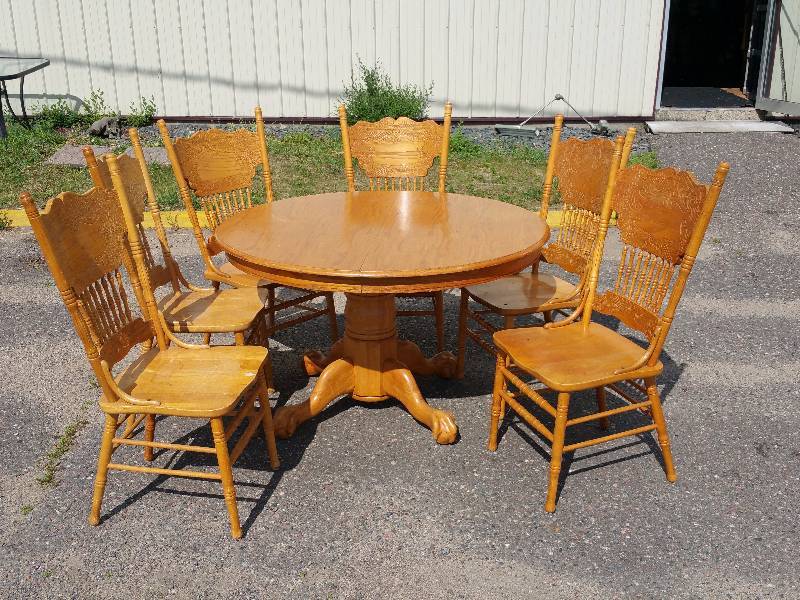 lot 6 image: Round Wooden Claw Footed Table & Pressed Back Chairs