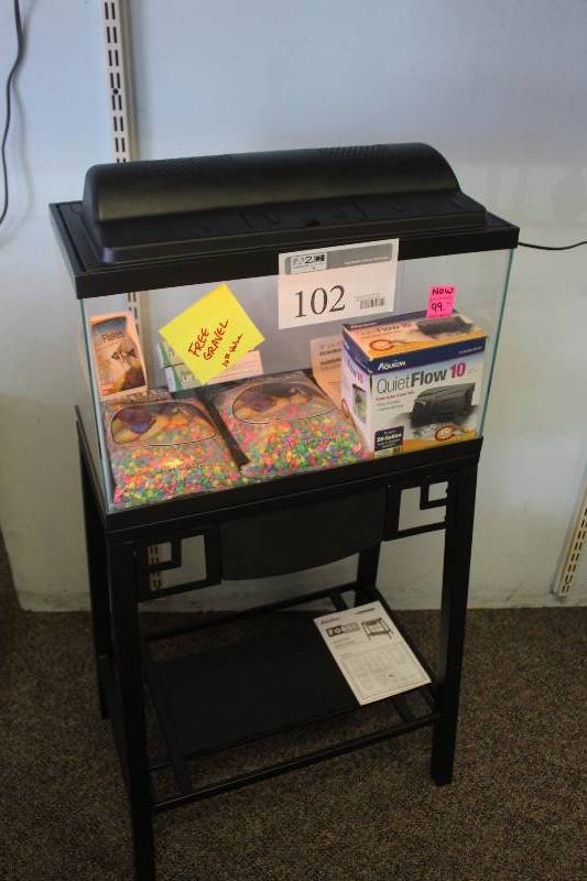lot 102 image: Lot of Aquarium Equipment Including 10-Gallon Aquarium, Stand, Pump, Gravel, Ligth, Hood, And More