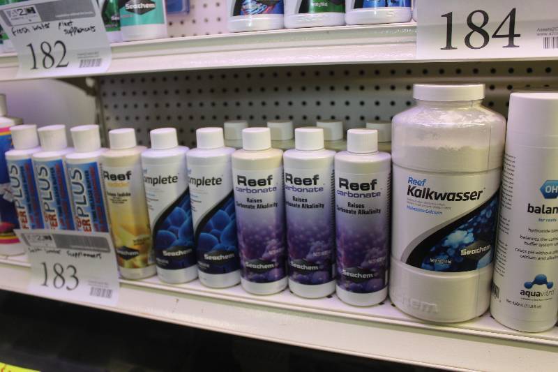 lot 183 image: Lot of Bottles Salt Water Supplements Including CaribSea AragaMilk Time Release Buffer, BufferPLUS Time Release Buffer, Reef iodide, Reef Complete, Reef carbonate, Reef Kalkwasser, AquaVitro OH Balance, AquaVitro I Vibrance, Boyd VitaChem