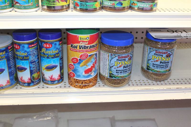 lot 196 image: Shelf Lot of Fish Food