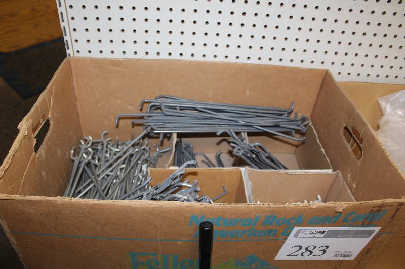 lot 283 image: Box Lot of Display Equipment - 40 lbs of Streeter Peg Board Holders and Pegs