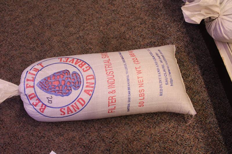 lot 272 image: Bag Lot of 50lbs Red Flint Sand & Gravel Filter & Industrial Sand