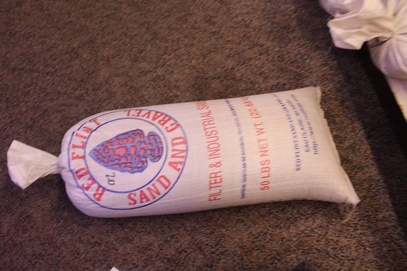 lot 273 image: Bag Lot of 50lbs Red Flint Sand & Gravel Filter & Industrial Sand