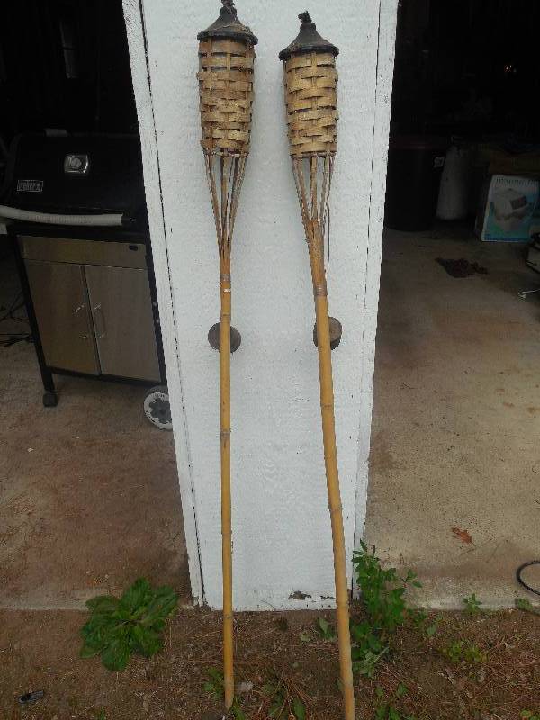 lot 79 image: (2) TIKI TORCHES