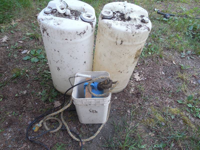 lot 94 image: 2 PLASTC BARRELS AND PUMP