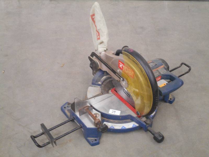 lot 39 image: Ryobi 12 Miter Saw With Dust Bag, ...