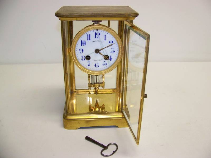 lot 4 image: Spalding and Co., Chicago and Paris, French, Table Top Clock with Crystal Regulator and Key