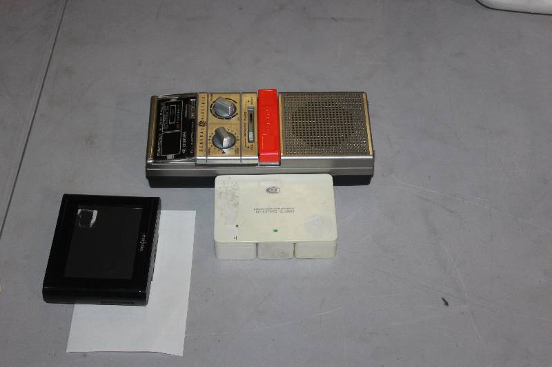 lot 83 image: Lot of (3) Electronics Including 1) Durabrand Travel Speaker System AND 1) GE CB Transceiver AND 1) Insignia NS-CNV10 GPS