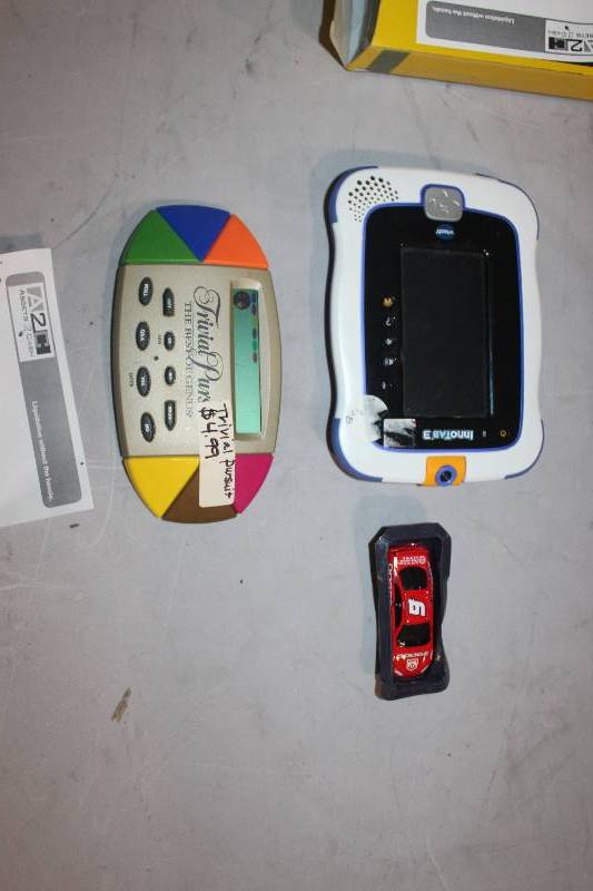 lot 119 image: Lot of (3) Electronic Games Including 1) Dodge #9 AND 1) Innotab 3 AND 1) Trivia Pursuit