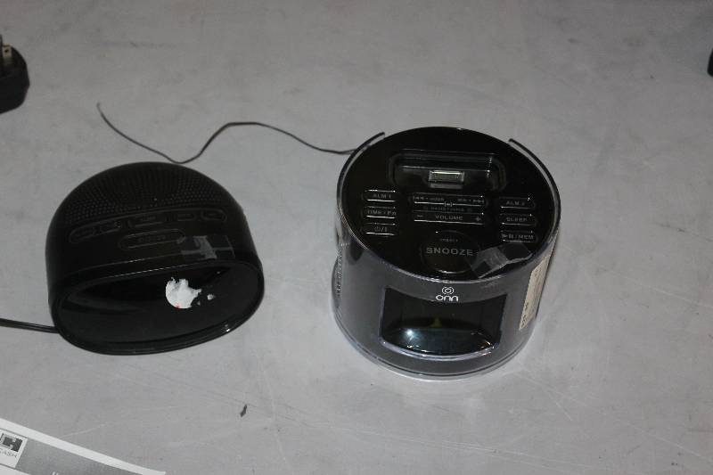 lot 75 image: Lot of (2) Electronics Including 1) RCA Docking Station AND 1) Onn Clock Radio